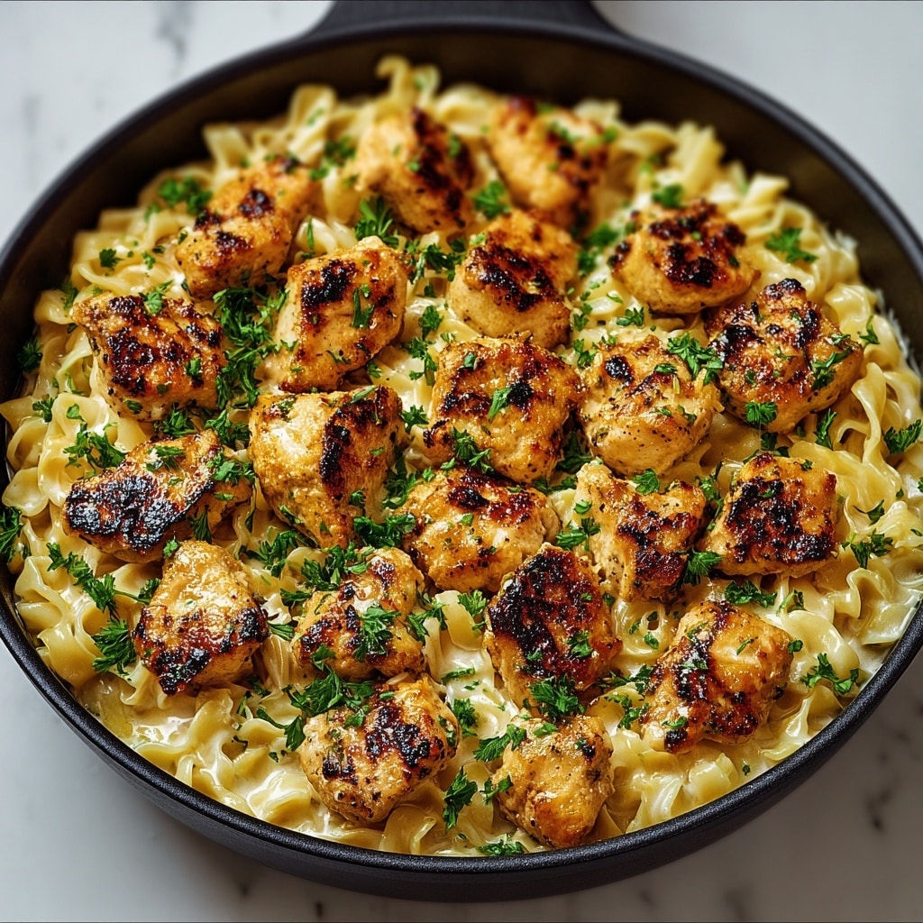 Garlic Butter Chicken Bites with Savory Creamy Parmesan Pasta Recipe - Recipe Image